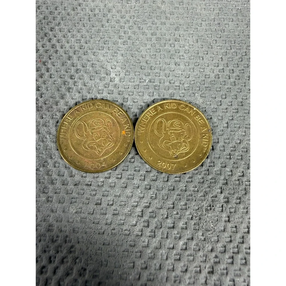 Chuck E. Cheese Game Tokens Lot of 2 Vintage 2004 2007 Collectible Arcade Coins